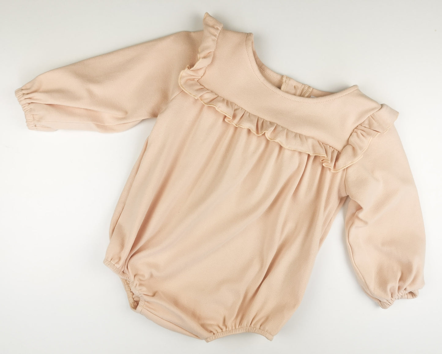 Olivia romper lys fersken