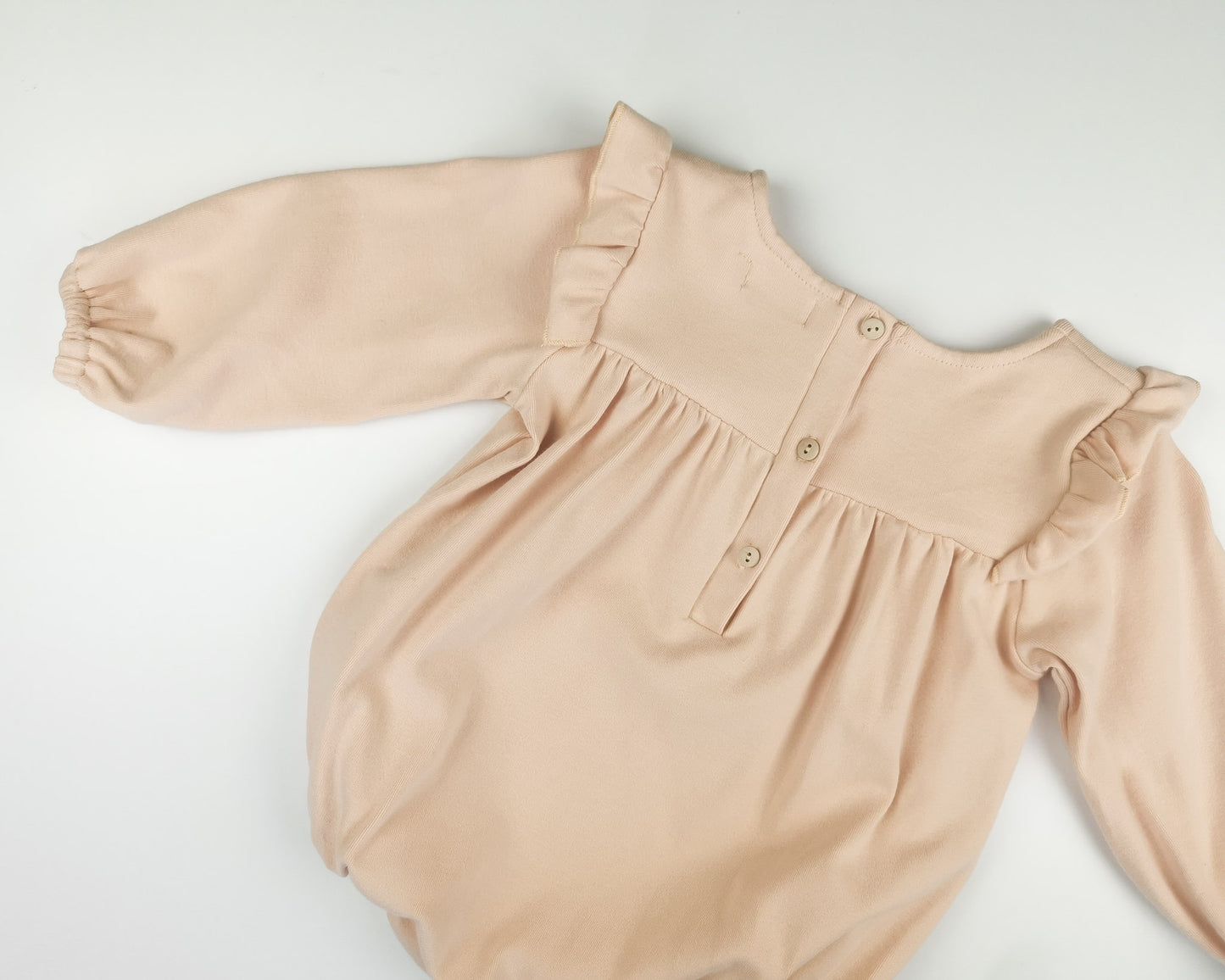 Olivia romper lys fersken